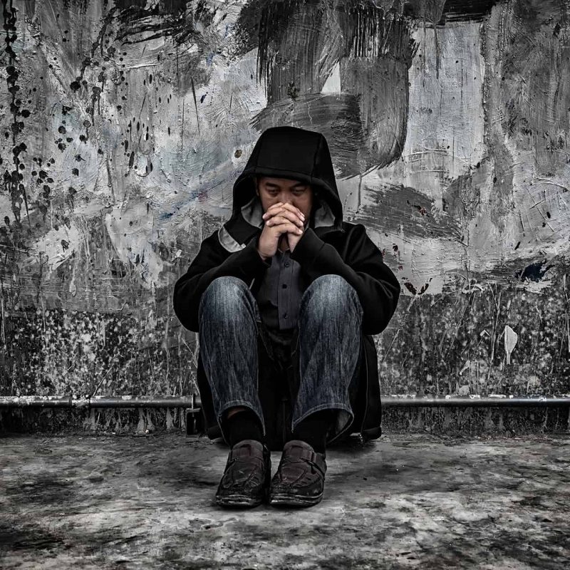 Drug abuse concept., overdose asian male drug addict with proble Drug abuse concept., overdose asian male drug addict with problems, man in hood with frustrated depression.